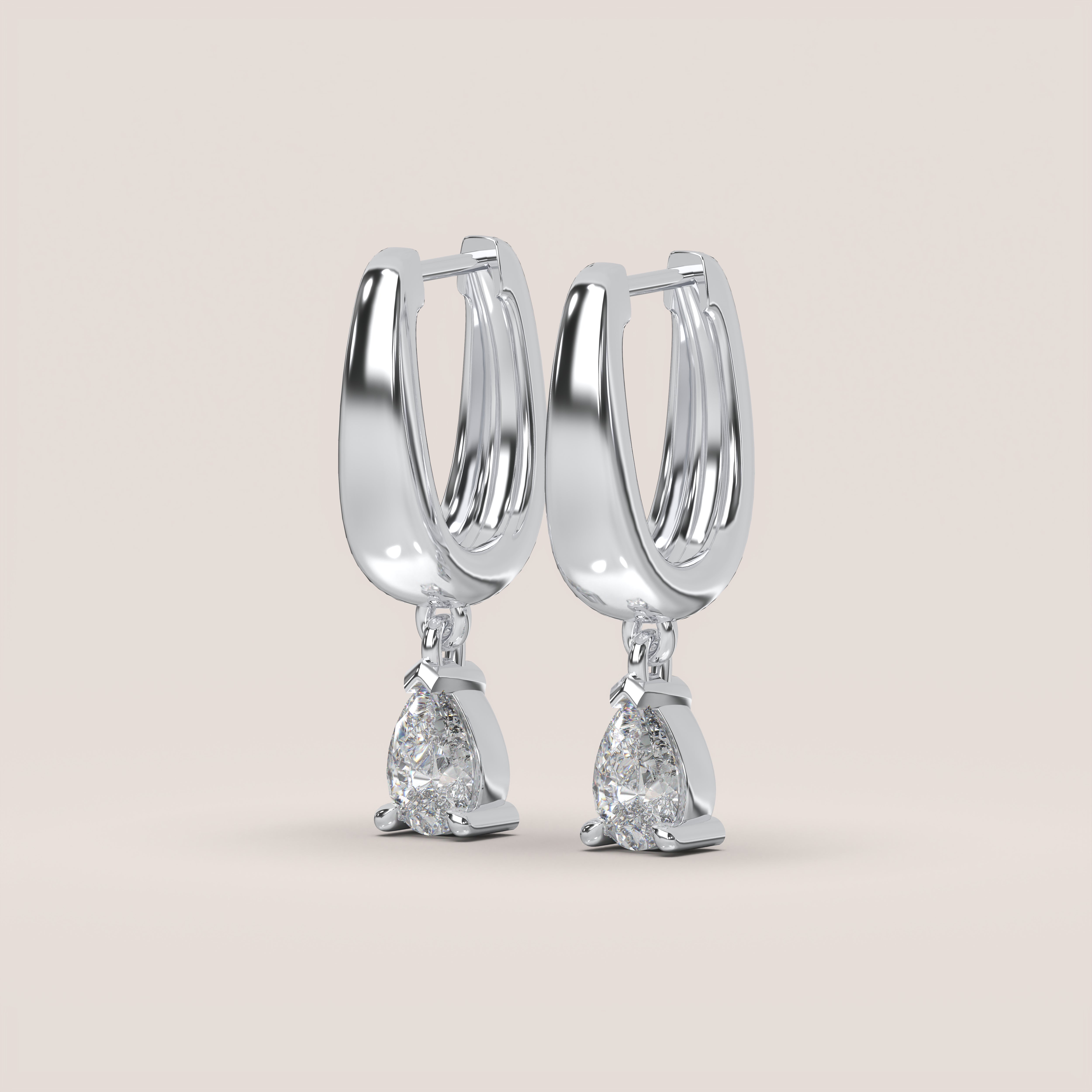 A pair of pear drop diamond earrings with a 1.4ct total diamond weight, set in 14k white gold.
