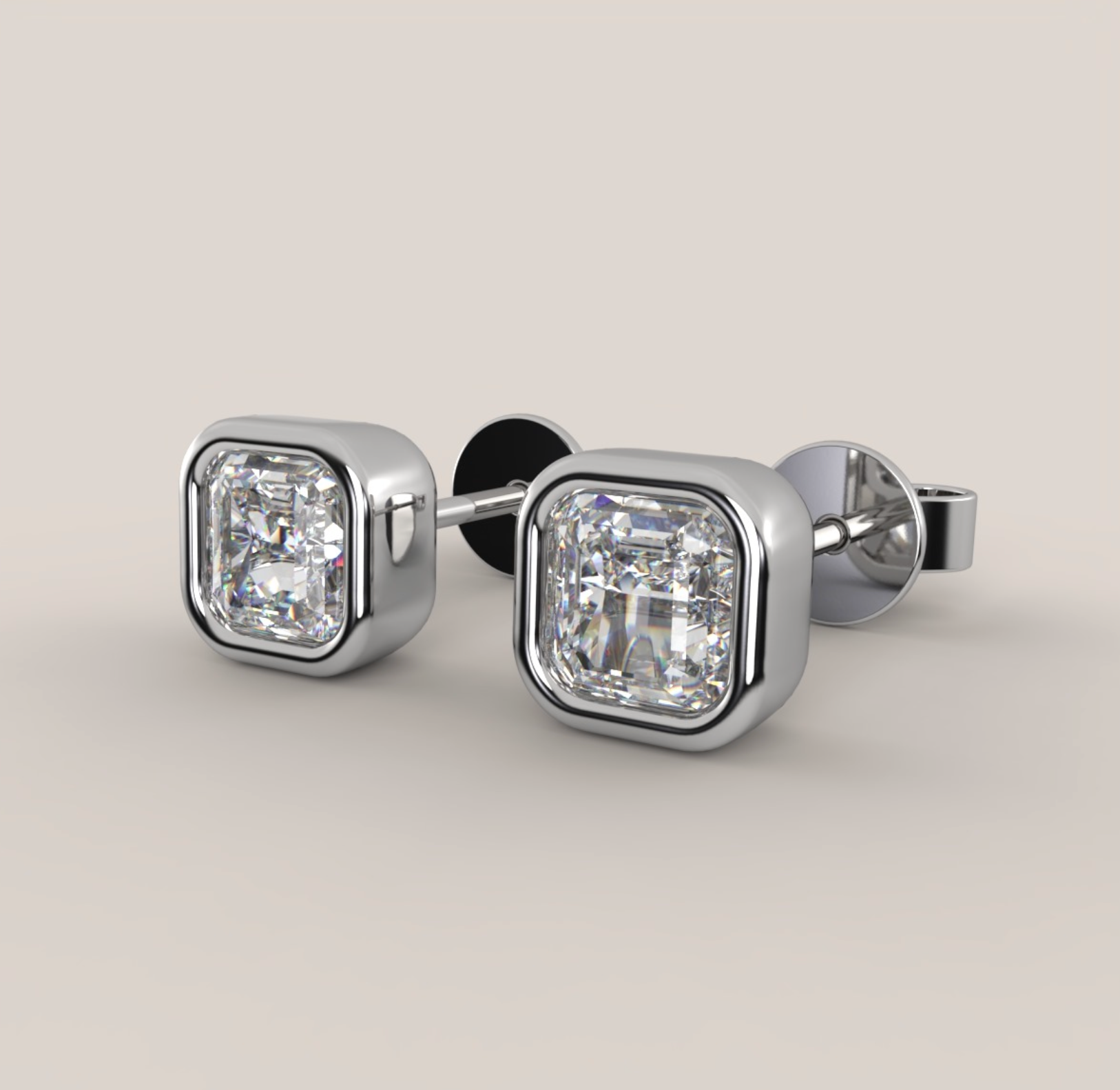 Pair of diamond stud earrings on a light gray background