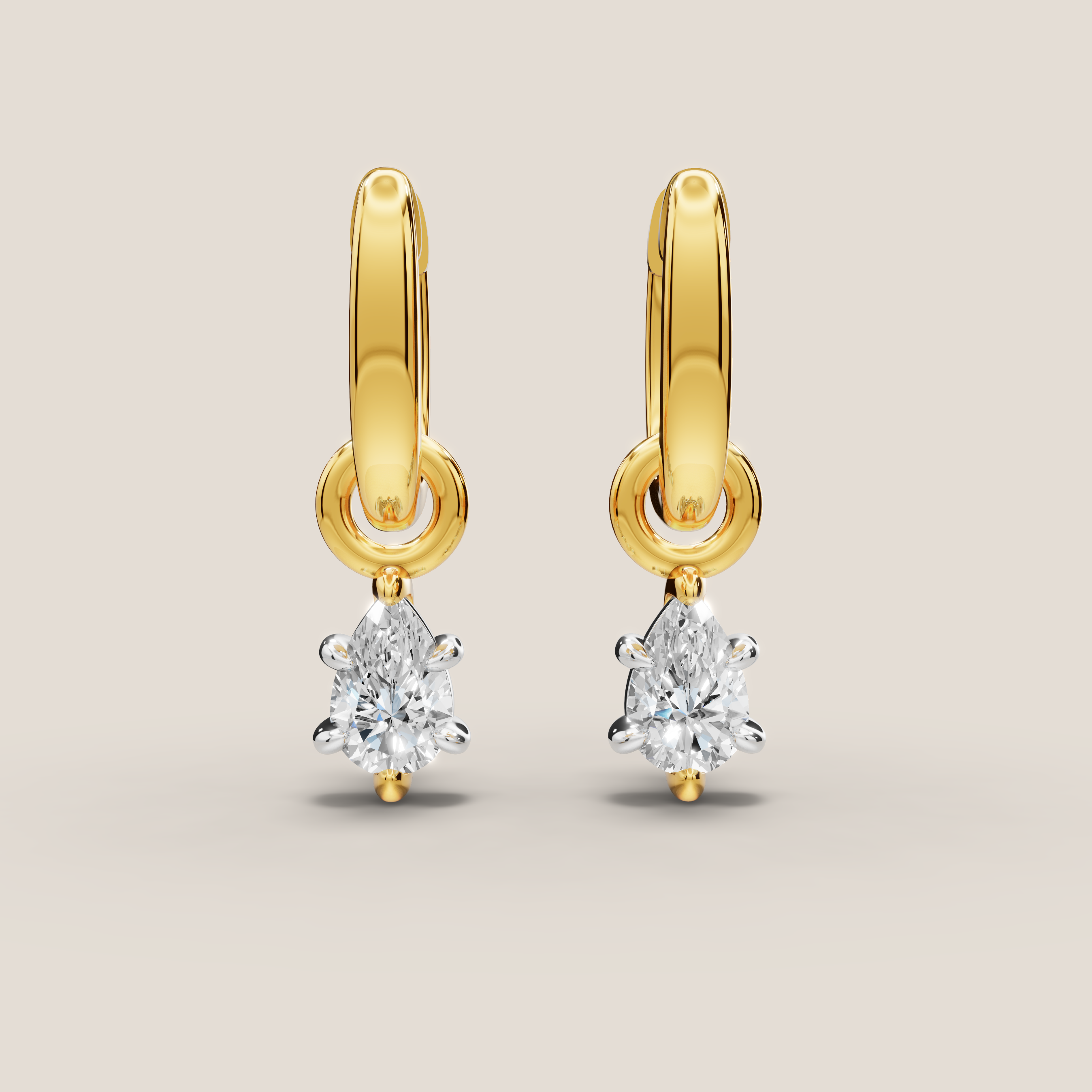 Gold earrings with diamond drops on a beige background