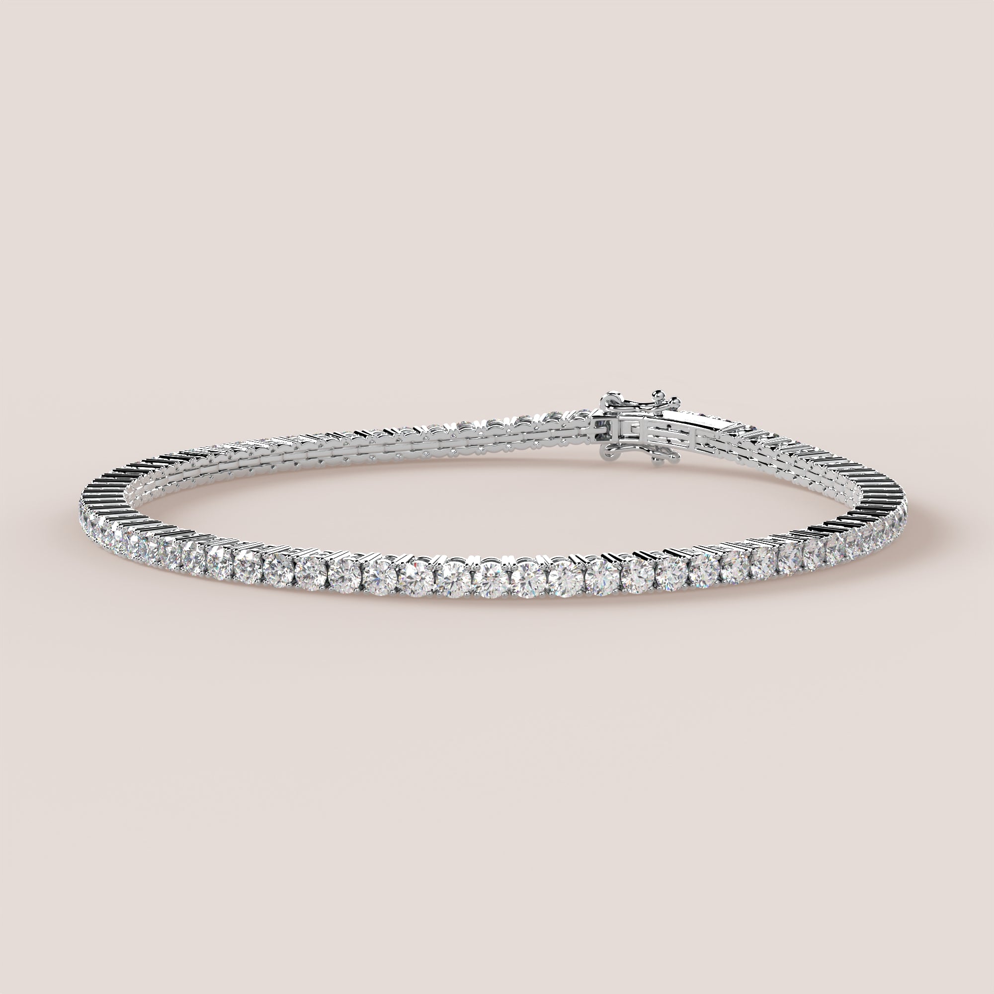 A tennis bracelet featuring lab-grown diamonds set in a 4-claw double bezel, crafted in 14k white gold.