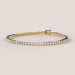 A tennis bracelet featuring lab-grown diamonds set in a 4-claw double bezel, crafted in 14k white gold.