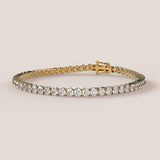 A tennis bracelet featuring lab-grown diamonds set in a 4-claw double bezel, crafted in 14k white gold.
