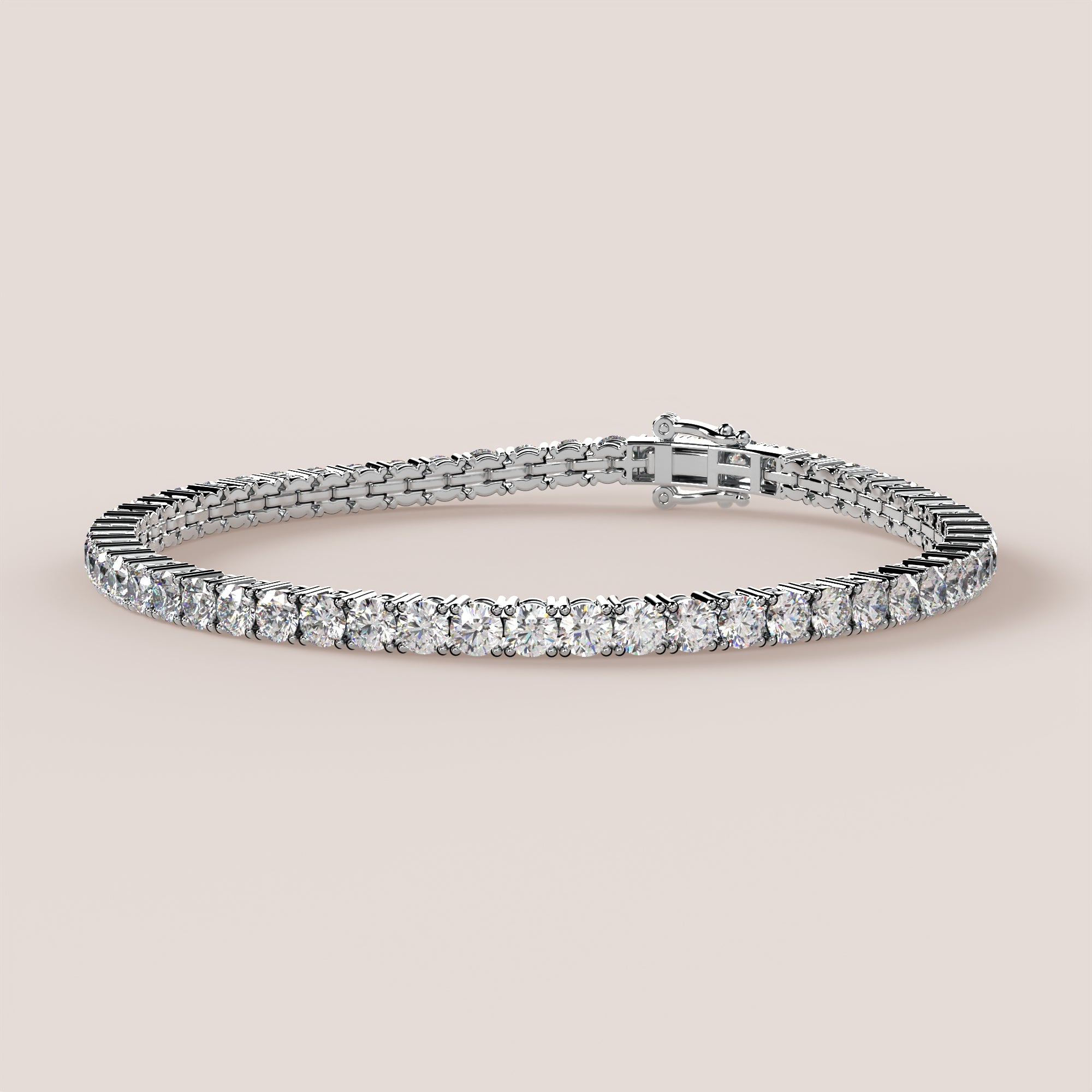 A tennis bracelet featuring lab-grown diamonds set in a double bezel in either white or yellow gold.