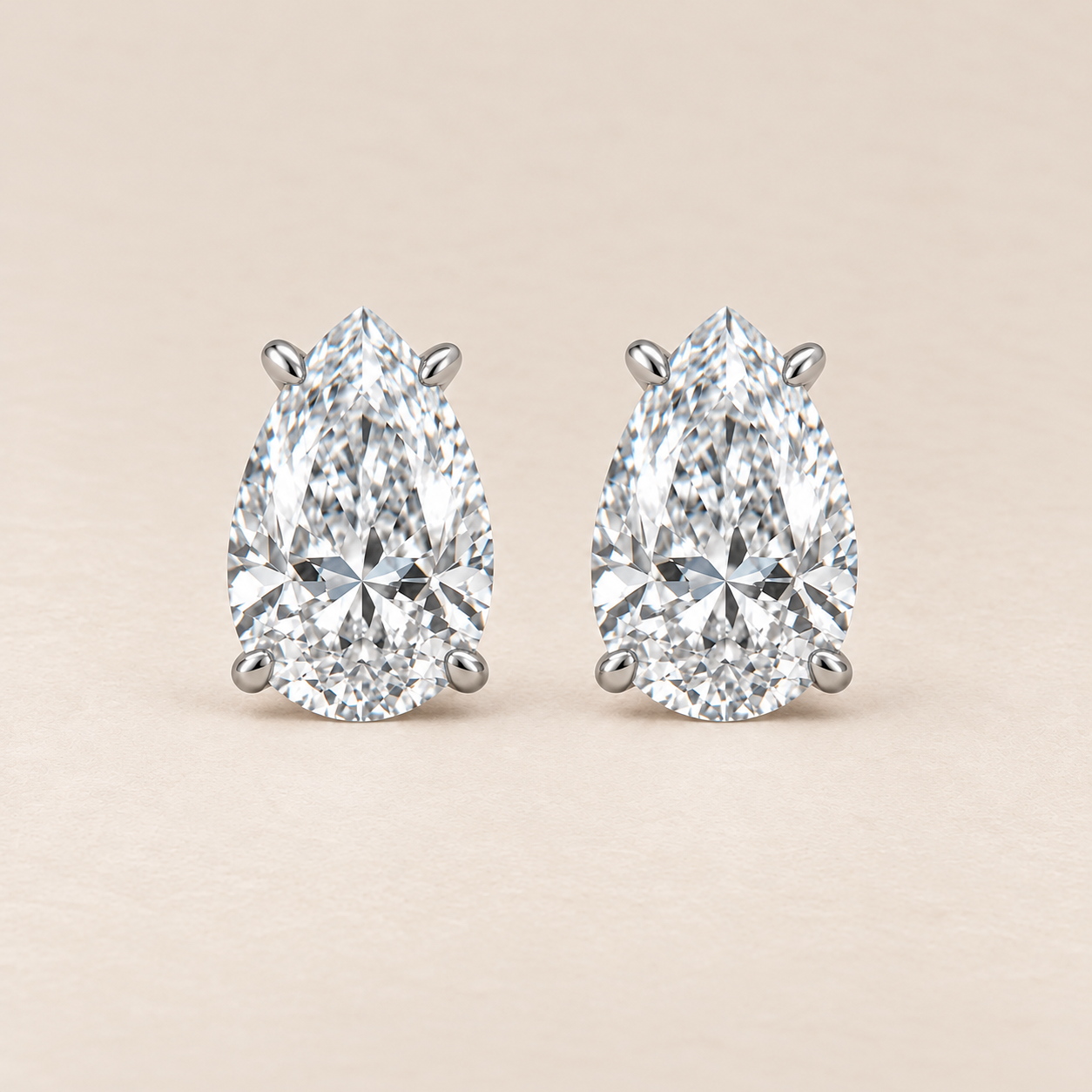 bianca-ray-4ct-pear-cut-lab-grown-diamond-four-claw-martini-stud-earrings-14k-white-gold-front.png