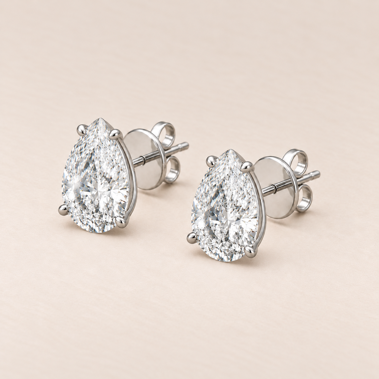 bianca-ray-4ct-pear-cut-lab-grown-diamond-four-claw-martini-stud-earrings-14k-white-gold-three-quarter.png